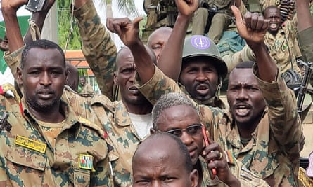 A photograph from the Sudanese armed forces shows their troops celebrating on 18 April after recapturing a military base in Nyala city.