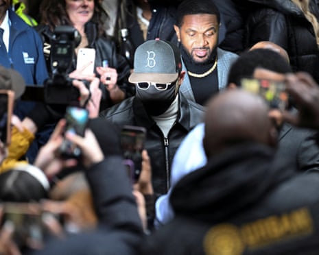 A masked Chris Brown leaving Southwark crown court on Monday