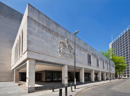 The grey exterior facade of a court building