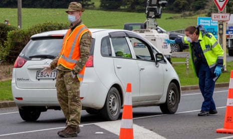 Police and military personnel set up a coronavirus checkpoint in Auckland, New Zealand. Defence force personnel are bolstering the country’s quarantine system. 