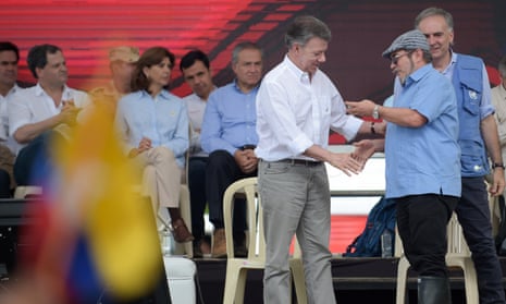 Farc rebel leader Rodrigo Londono Echeverri and Colombian president Juan Manuel Santos attend the final act of disarmament.