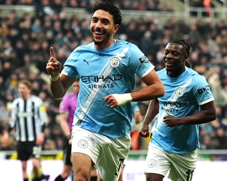 Manchester City's Omar Marmoush (centre) celebrates scoring their side's third goal of the game with teammates.