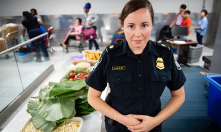 Tasha Mashburn near some agricultural contraband confiscated from the luggage of international travelers arriving at the airport.