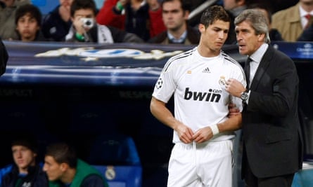 Manuel Pellegrini (right) chats to Cristiano Ronaldo during his season as Real Madrid manager