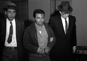 Perry Smith is led by police officers into the courthouse in 1960.