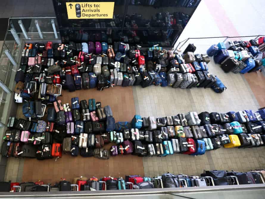 Queues with passenger luggage at Heathrow Airport on June 19