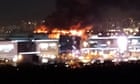 Moscow concert hall attack: venue on fire after gunmen shoot at crowds – live updates