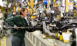 A worker at the Jaguar Land Rover site in Castle Bromwich, West Midlands. The car giant is to build a range of electric cars in the UK.