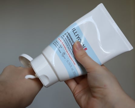 The writer using the Illiyoon ceramide ato concentrate cream