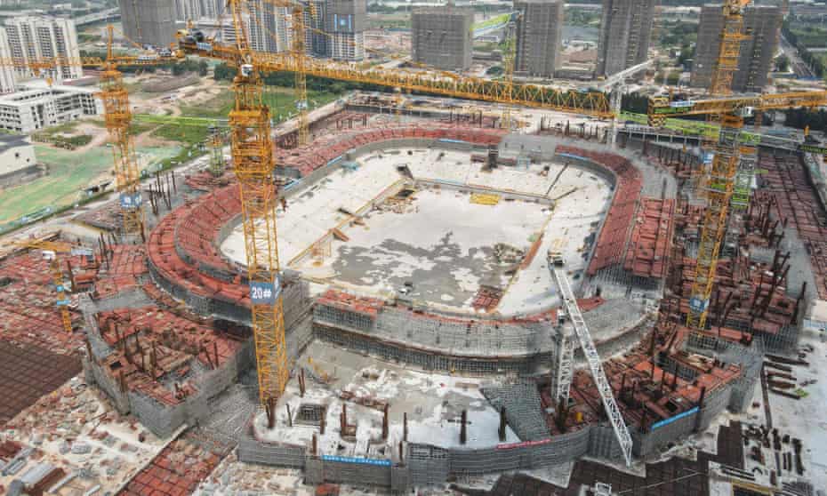 Guangzhou Evergrande Stadium, designed to be the world's largest dedicated soccer stadium, is under construction in South China's Guangdong Province.
