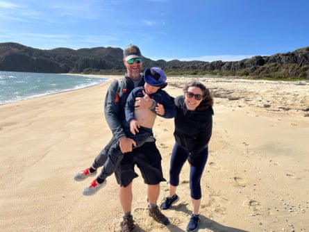 Americans Amy Armstrong, Miles Nolte and their son Beck on a beach in New Zealand.