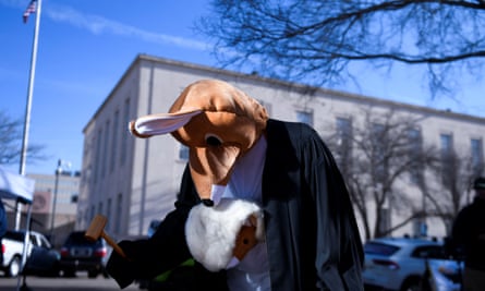Jaime Cruz bangs a gavel in a kangaroo costume during the Women’s March protest outside of the federal courthouse in Amarillo, Texas.