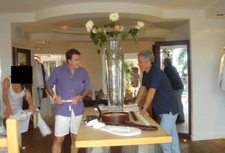 Mandelson and Epstein standing on opposite side of a display table in a shop