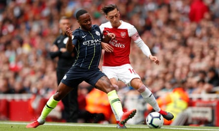 Raheem Sterling and Arsenal’s Mesut Özil battle for possession in Manchester City’s victory at the Emirates Stadium.