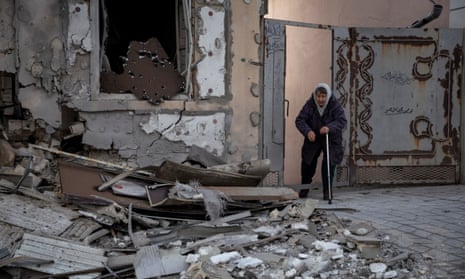 Klavdia, 82, stands near her house which was destroyed by a Russian military strike in Kherson, Ukraine.