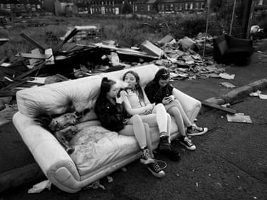 Girls Sitting on a Couch Dropped at a Pavement on Ravenhill (from the series Youth of Belfast)