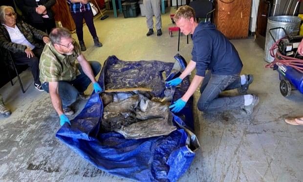 The baby woolly mammoth is wrapped up following a ceremony with elders of the Trʼondëk Hwëchʼin First Nation