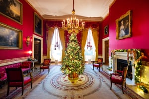 A Christmas tree is seen at the center of the Red Room during a press preview of the White House holiday decor