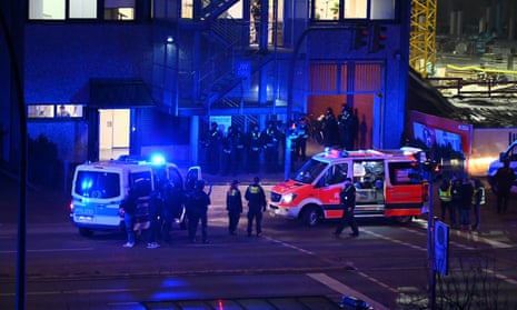 Armed police officers near the scene of a shooting in Hamburg, Germany 
