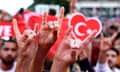 Turkey fans making the 'wolf salute' with their hands at a Euros 2024 match in Berlin.