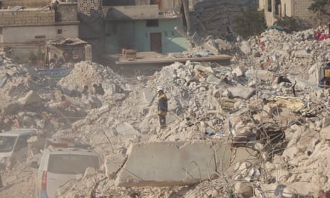 A White Helmet volunteer stands among the rubble in Harem, Idlib, Syria on 10 February.