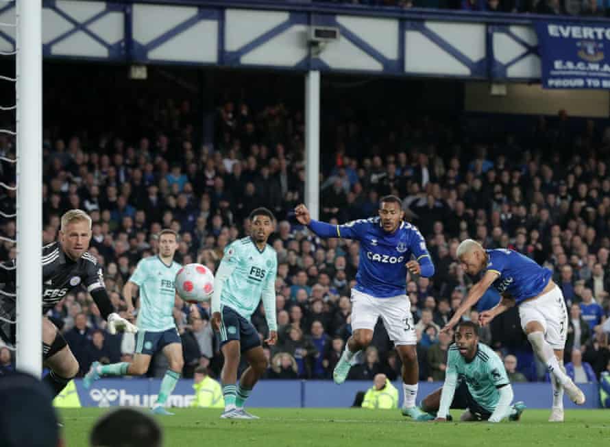 Everton’s Richarlison scores their first goal.