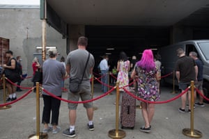 People waiting in queue at the Opera Australia warehouse.