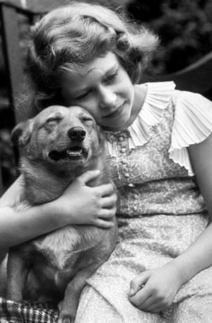 1936: Elizabeth hugging a corgi dog