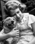biography for queen elizabeth Princess Elizabeth hugging a corgi dog, 1936