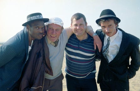 Patrick Murray as Mickey, right, with, from left, Steven Woodcock as Jevon, Roy Heather as Sid, and Kenneth MacDonald as Mike, during the filming of the Only Fools and Horses Christmas special, “The Jolly Boy’s Outing”, in Margate, Kent, in May 1989.