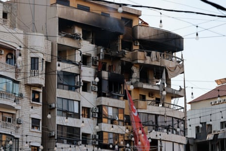 A damaged building is seen after an Israeli airstrike in the southern suburb neighbourhood of Haret Hreik in Beirut.