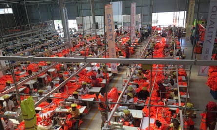 Rwandan workers make safety uniforms at C&amp;H Garments, a Chinese factory with operations in Kigali.