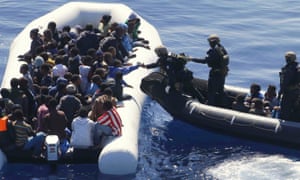 German navy sailors reach a migrants’ boat off the coast of Libya in March 2016. 