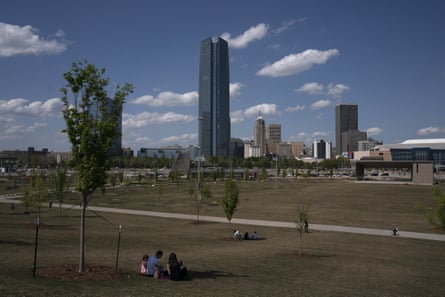 People sit at a distance in downtown Oklahoma City in late April.