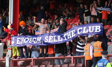 Oldham fans protest against the owner, Abdallah Lemsagam, during last Saturday’s 4-0 defeat at Leyton Orient.