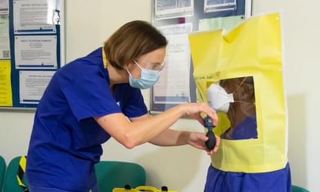 A member of intensive care staff, is ‘fit-tested’ for an FFP3 mask. There are now demands for anyone caring for a Covid-19 patient to have one.