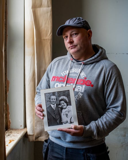 Paul Gilbert holding a picture of his mother