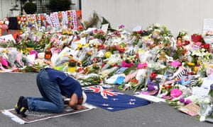 A man prays at a makeshift memorial at Al Noor Mosque in Christchurch.