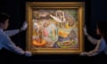 Art handlers lift Leonora Carrington's Les Distractions de Dagobert at Sotheby's auction house in New York. The painting is framed in gold and it is being placed on a black wall; the handlers wear white gloves white shirts and are seen in the shadows, while the painting's rich colours shine out.