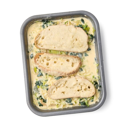 Felicity Cloake’s strata – custard poured over the pan with bread, spinach, leek and cheese