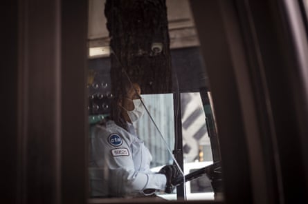 A driver wearing a protective mask operates a Chicago Transit Authority bus in Chicago, Illinois, in April.
