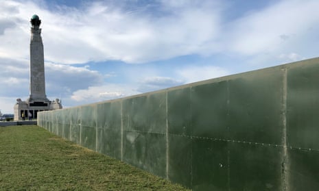 Dividing wall: a military-style metal fence has been put up in Portsmouth to protect Donald Trump.