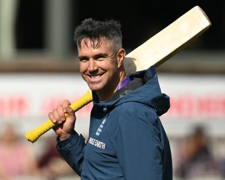 Kevin Pietersen smiles and holds a bat