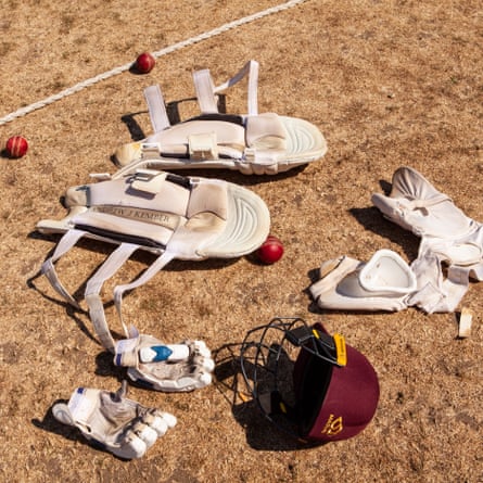 A batter’s kit dries out in the sun by the boundary.