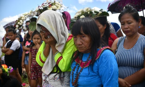 People attend the burial of Olivia Arevalo, who was shot dead near her home. Ayahuasca has been used successfully to treat PTSD and drug addictions, but there is a darker side.