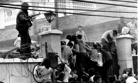 Mobs scale the wall of the US embassy in Saigon, just before the end of the Vietnam War in 1975.