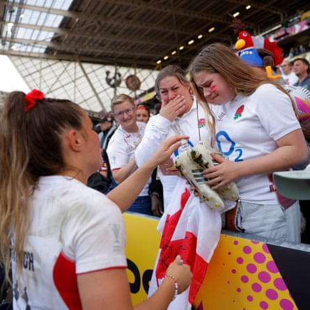 A mother and daughter start crying as Jess Breach of England hands over her autographed boots after the Women’s Rugby World Cup 2025 semi-final victory over France.