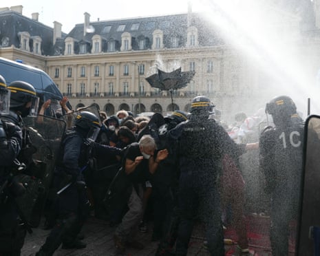 Water cannons are used by riot police during clashes on the sidelines of a demonstration of high-school students in Rennes, western France.