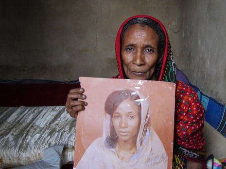 Khadidja Zidane holds a picture of her as a young woman, newly married, before she was arrested and raped by Habré.