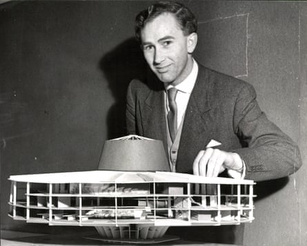 Black and white photo of Peter Womersley with a model for a hypothetical theatre.